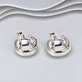 Pair of polished 925 sterling silver chunky huggie hoop earrings with broad front sections and hinged fastenings