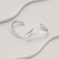 Crossover Artisan Sterling Silver Bangle — Handcrafted Exclusive