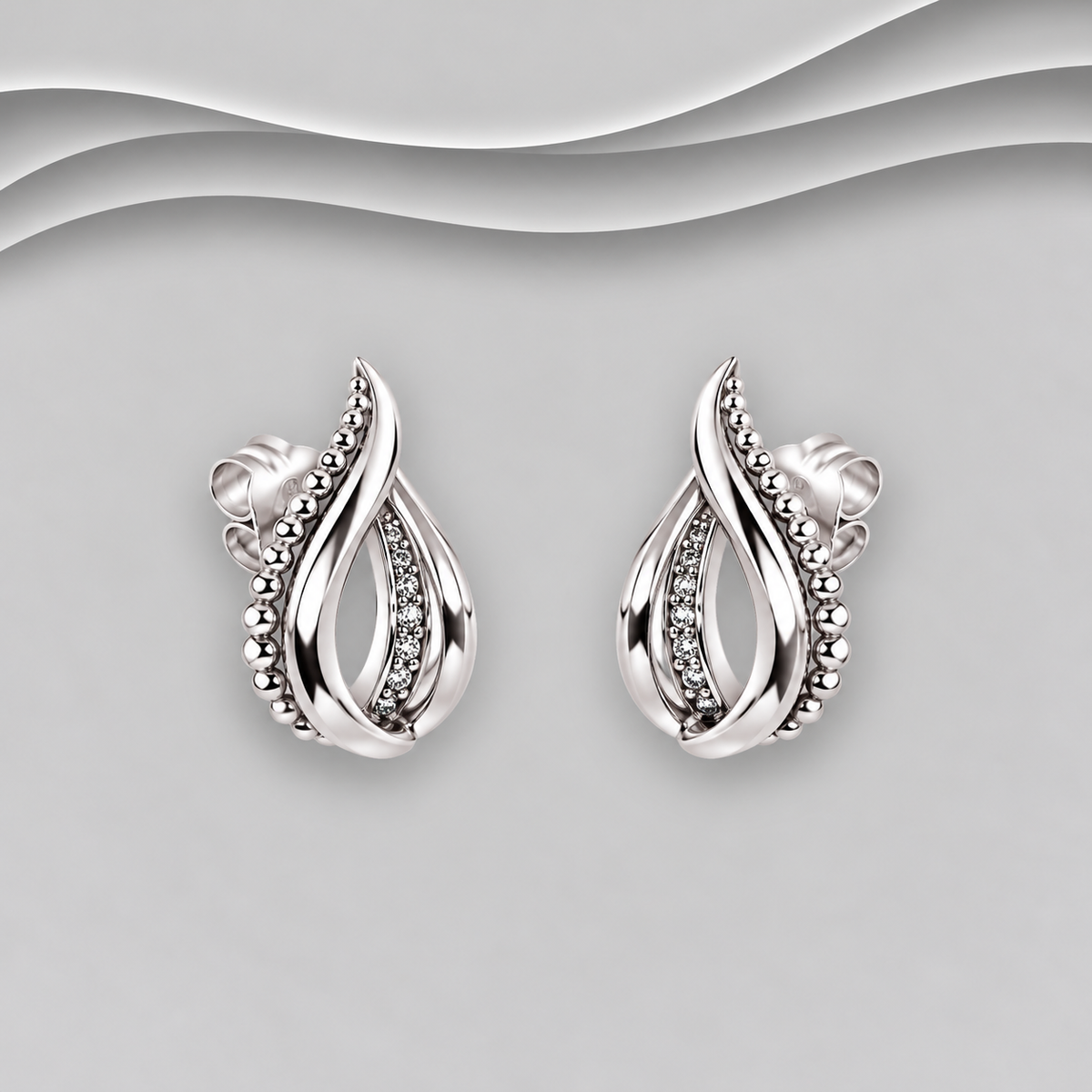 Hand crafted 925 sterling silver teardrop stud earrings with twisted strands, polished silver beads and a textured inner strand