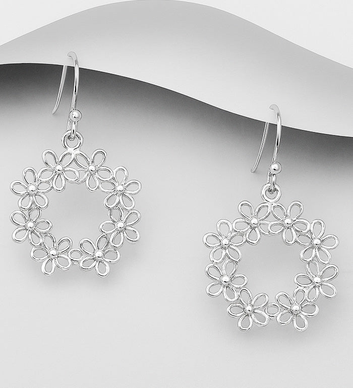 A delicately sculpted silver flower forms the heart of this design rafted In 925 Sterling Silver