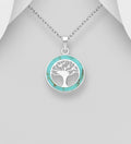 Round sterling silver openwork Tree of Life pendant with a turquoise resin border, shown on a chain
